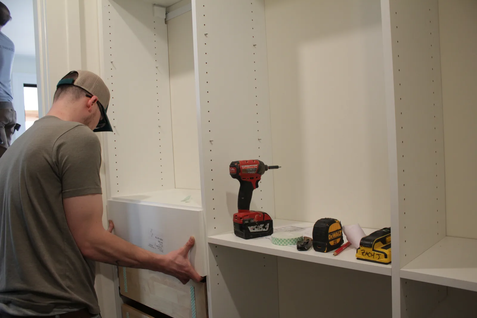 Diplomat installation team fitting a custom closet
