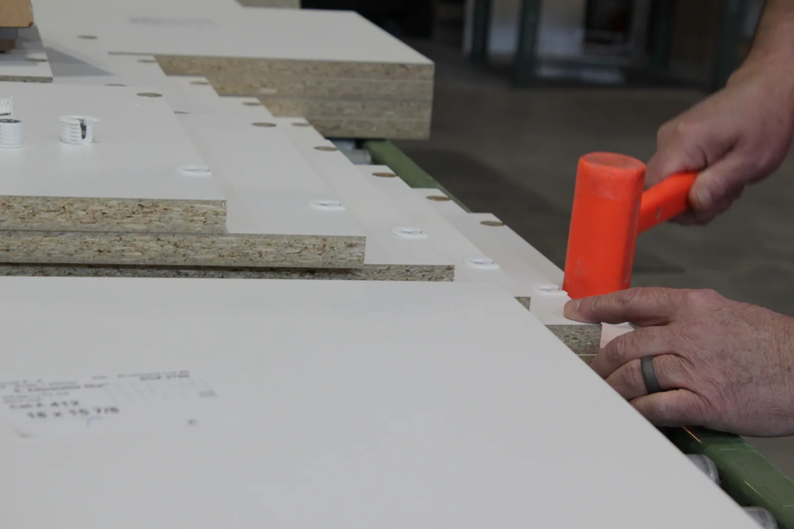 A Diplomat craftsman assembling a cabinet panel at the Downingtown manufacturing facility