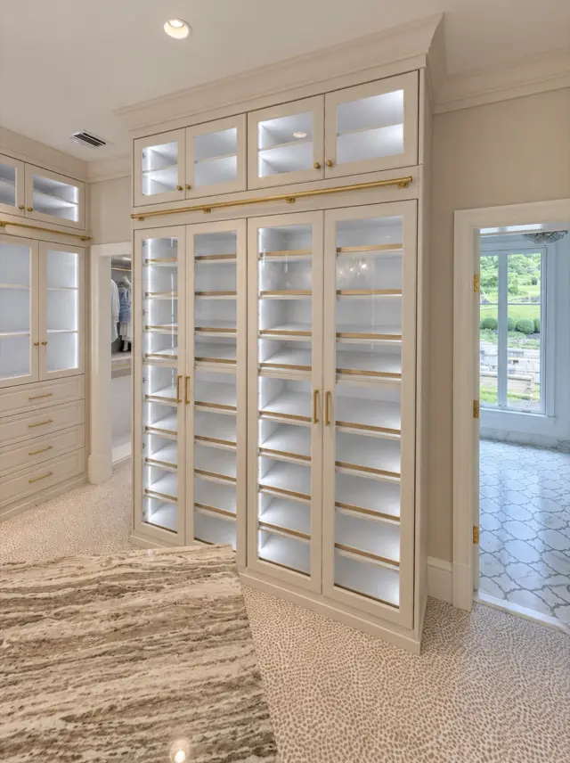 Cream glass-door shoe cabinet with lit shelves and glass uppers