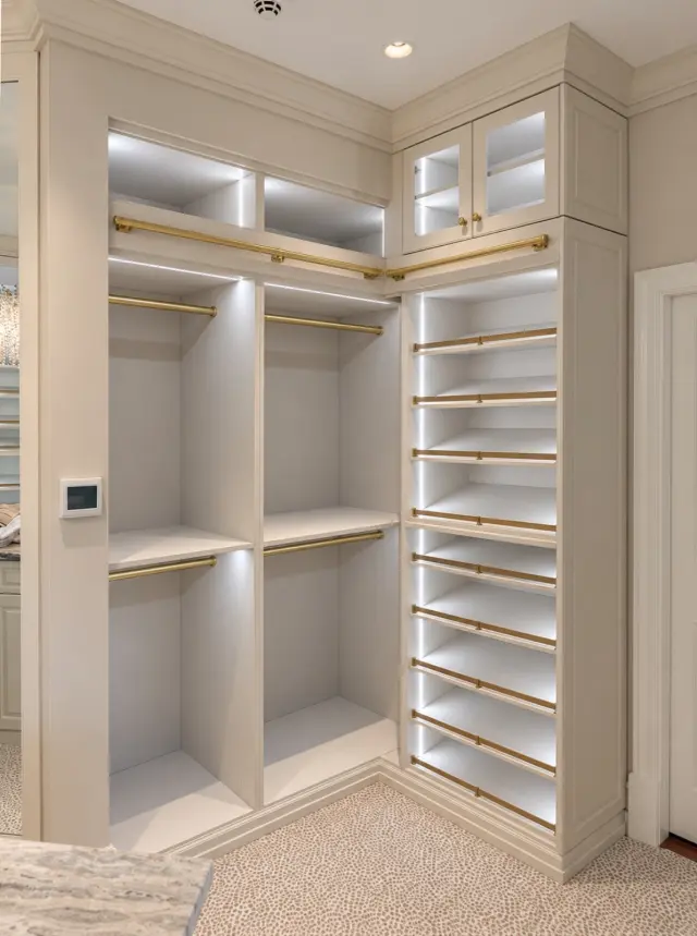 Cream corner unit with lit hanging and angled shoe shelves