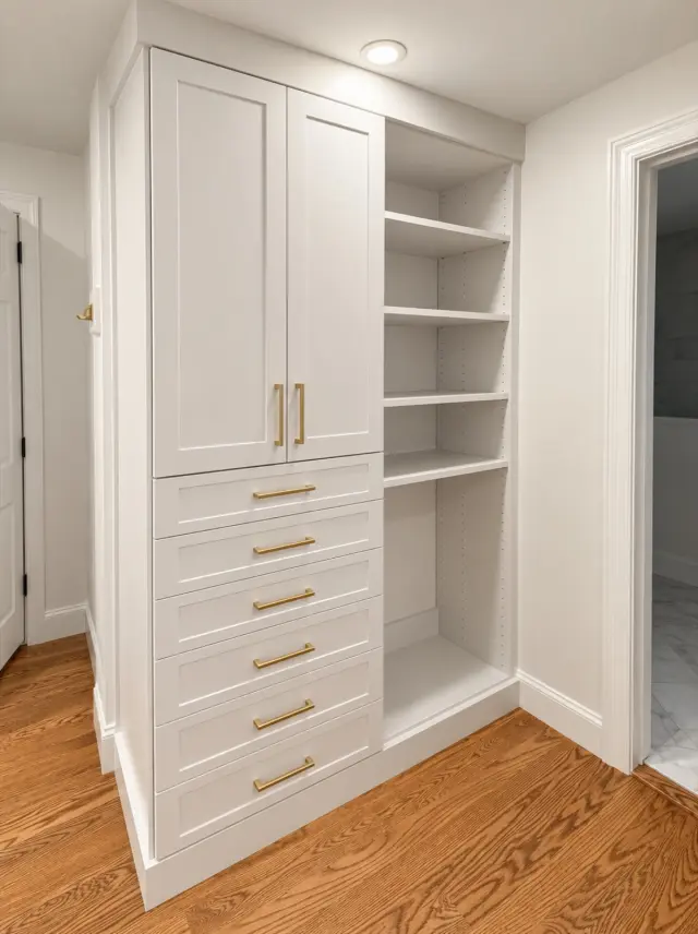 White tall cabinet and drawer stack beside open shelving