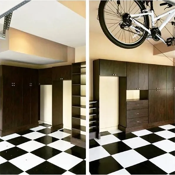Dark garage cabinets with a bike hanging above a checkered floor
