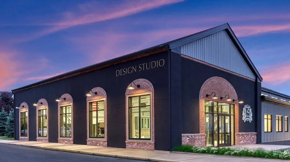 Exterior of the Diplomat Closet Design studio building at dusk