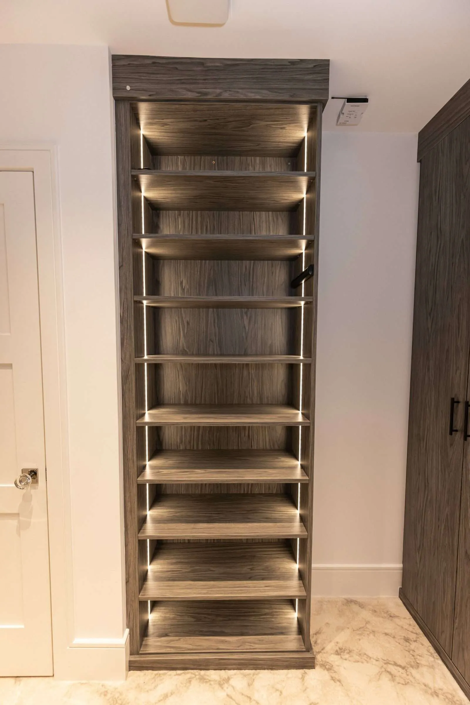 Tall wood-grain shoe tower with open shelves
