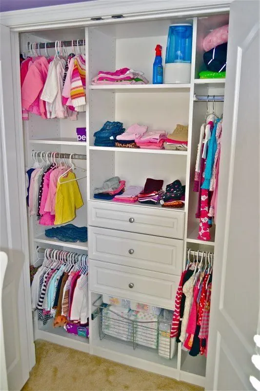 Children's reach-in closet with shelves, drawers and hanging clothes