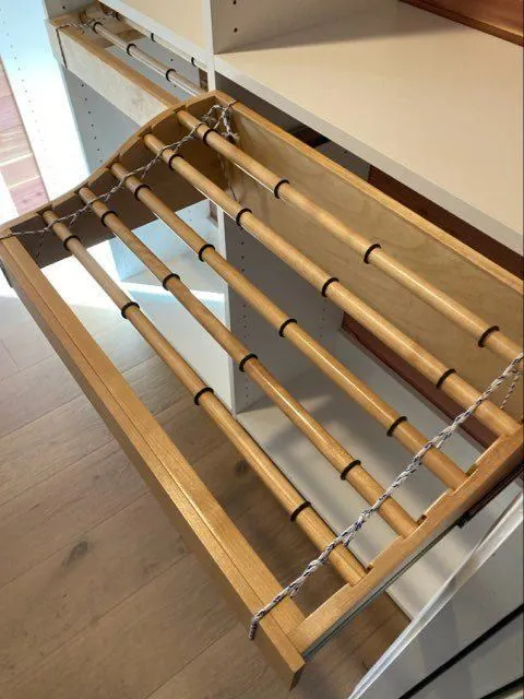 Pull-out wood rack extended from a cabinet
