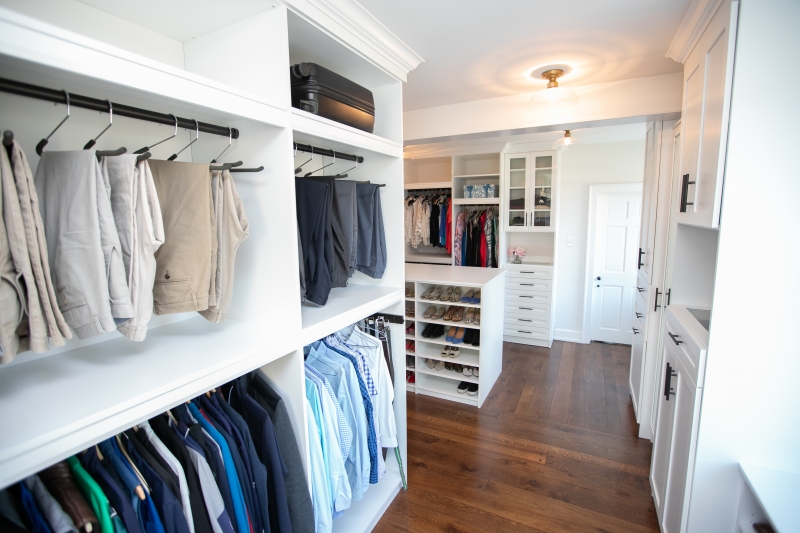 Walk In Custom Closet with Pink Rug - Transitional - Closet